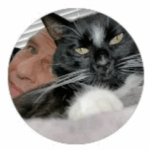 Person with a black and white cat, representing a friendly and approachable atmosphere for US Concrete Construction's customer-focused service.